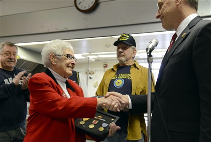Widow receives husband\'s World War II service medals
