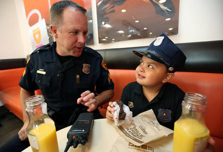 5-year-old leukemia survivor dons police badge to battle bad guys for a day